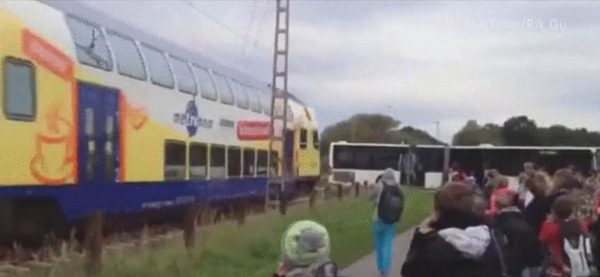 German-Train-Smashes-Into-Broken-Down-School-Bus-While-Passengers-Watch